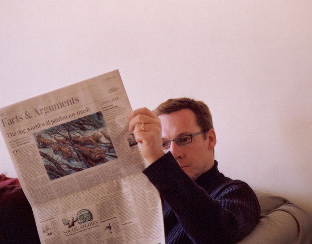 Man reading newspaper